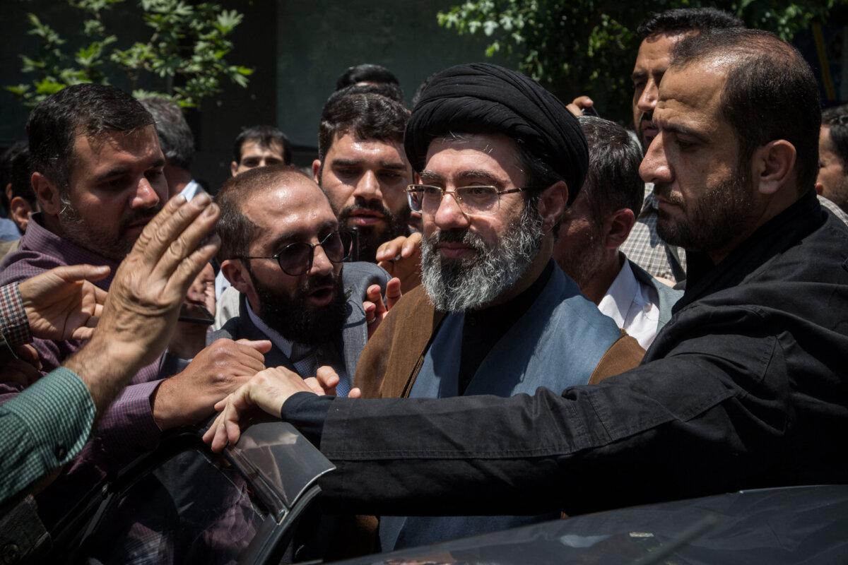 Mojtaba Khamenei (C), the son of the Iranian leader Ali Khamenei, participates in the annual Quds Day rally in Tehran, Iran, on May 31, 2019. (Rouzbeh Fouladi/Middle East Images/AFP via Getty Images)