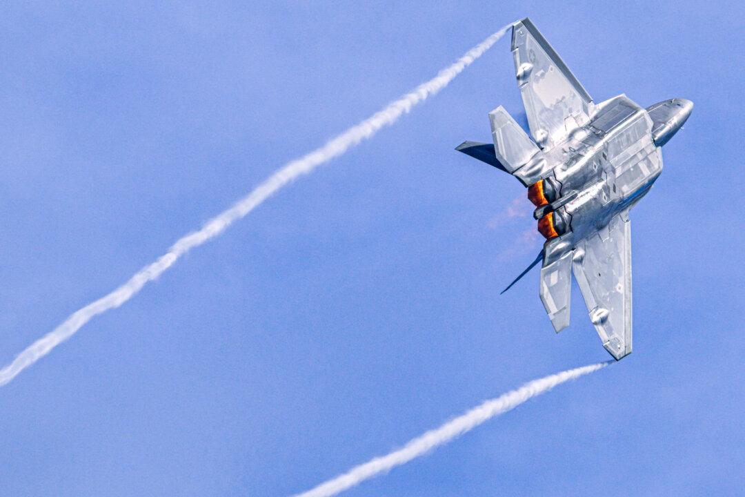 (Top Left) A U.S. F-15 fighter plane prepares for landing in Mildenhall, England, on Jan. 7, 2026. (Top Right) B-2 Spirit Bombers fly over the White House on July 4, 2025. (Bottom Left) A U.S. F-35 fighter plane takes off in Mildenhall, England, on Jan. 7, 2026. (Bottom Right) A U.S. Air Force F22-Raptor takes off in Ceiba, Puerto Rico, on Jan. 4, 2026. (Dan Kitwood/Getty Images, Eric Lee/Getty Images, Miguel J. Rodriguez Carrillo / AFP via Getty Images)