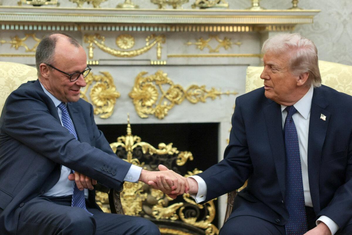 U.S. President Donald Trump (R) and German Chancellor Friedrich Merz shake hands as they meet in the Oval Office at the White House in Washington on March 3, 2026. (Jonathan Ernst/Reuters)