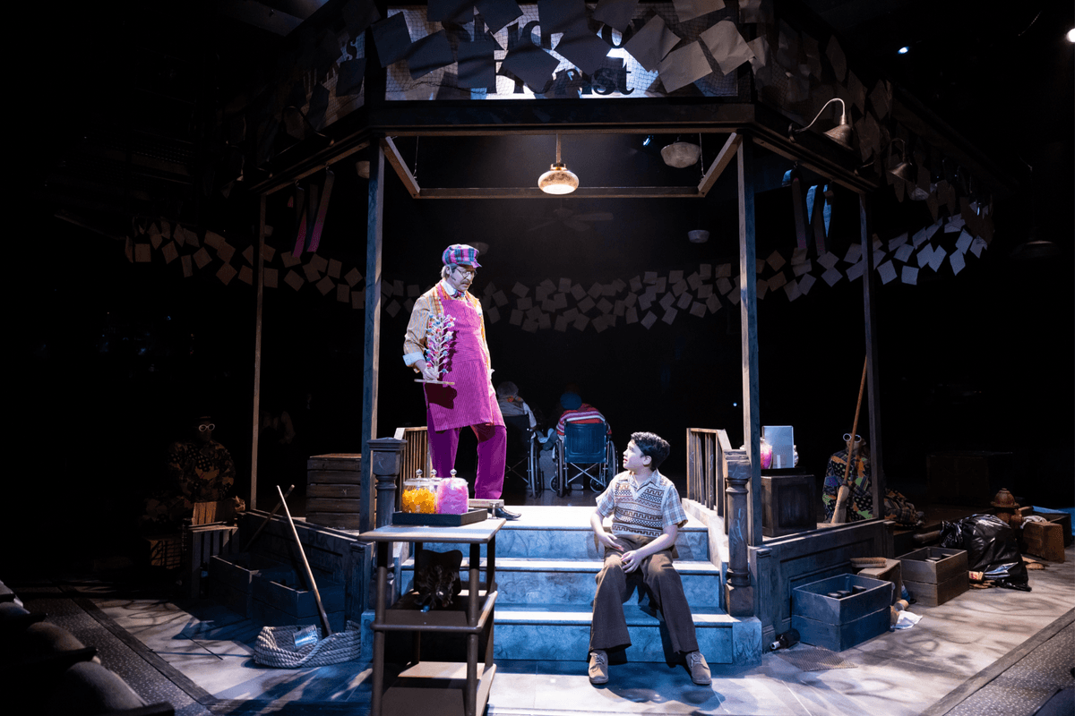 Willy Wonka (George Edgar, L) talks to Charlie (Kai Edgar), in "Charlie and the Chocolate Factory." (Justin Barbin)