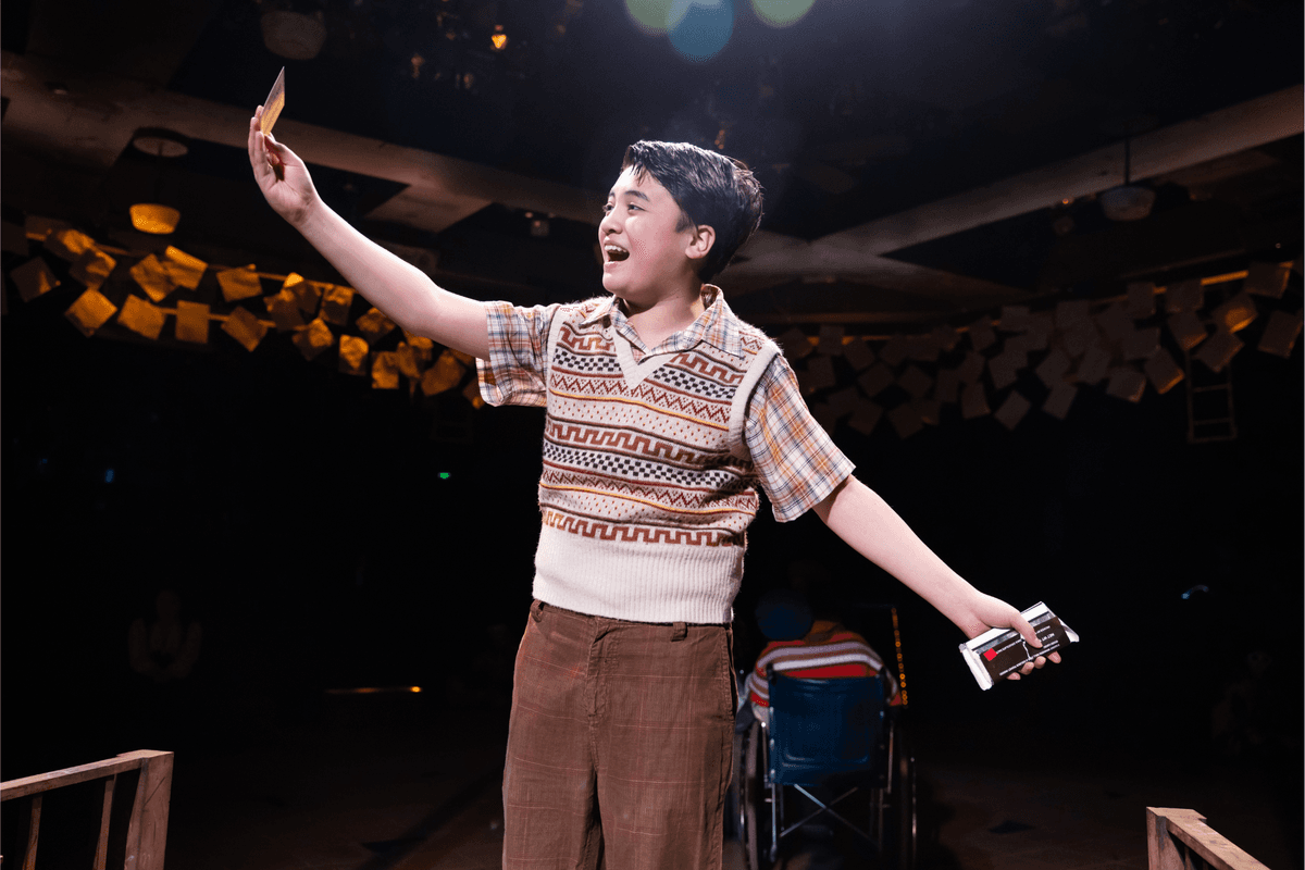Charlie (Kai Edgar) discovers a golden ticket in his chocolate bar, in "Charlie and the Chocolate Factory." (Justin Barbin)