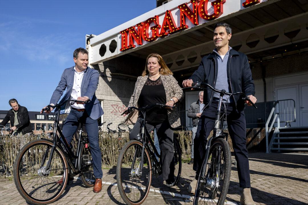 Dutch Prime Minister Rob Jetten gets on his bike during a visit to projects that are part of the National Program for Livability and Safety (NPLV) in Roosendaal on March 5, 2026. Within this program, schools, institutions, and cooperatives collaborate with residents, businesses, and organizations to improve the quality of life and safety in neighborhoods. (Photo by Remko de Waal / ANP / AFP via Getty Images) / Netherlands OUT