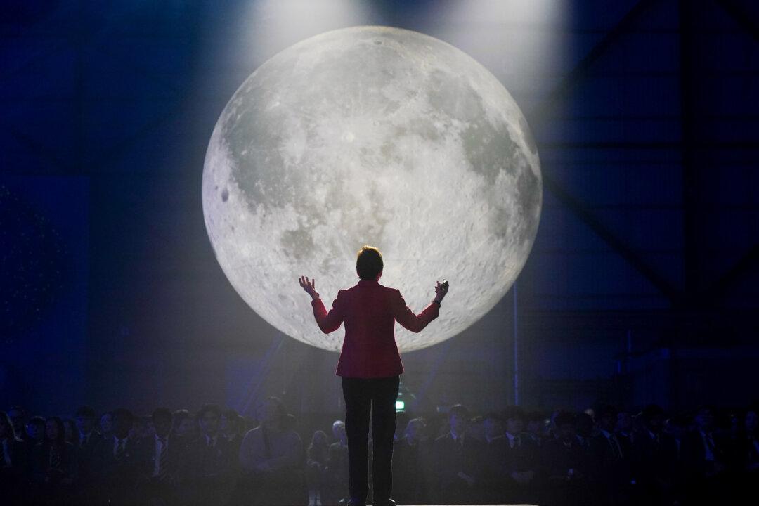 BLYTH, ENGLAND - MARCH 05: Helen Sharman, Britain's first astronaut, speaks to local schoolchildren about her time in space, as artist Luke Jerram's ‘Museum of the Moon & Gaia’ is displayed in what is a world-first, as both his Moon and Gaia (the Earth) installations are shown together during the Blyth Festival of Energy event at the Offshore Renewable Energy (ORE) Catapult, National Renewable Energy Centre on March 05, 2026 in Blyth, England. Each seven-metre artwork is created from detailed NASA imagery and accompanied by a special soundtrack and is exhibited in The Offshore Renewable Energy Catapult's testing facilities. The Blyth Festival of Energy is a four-day celebration taking place from 5–8 March 2026 in Blyth, Northumberland. It serves as the grand finale of the "Blyth Celebrates" campaign, highlighting the town's heritage and its status as a global leader in offshore renewable energy. (Photo by Ian Forsyth/Getty Images)