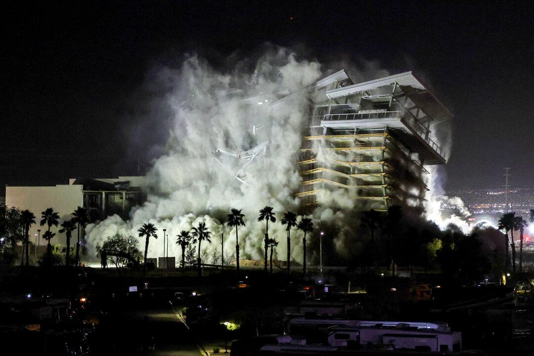 LAS VEGAS, NEVADA - MARCH 05: The tower of the Eastside Cannery Casino and Hotel is demolished by implosion early on March 05, 2026 in Las Vegas, Nevada. The property, which opened in 2008, closed in March 2020 due to the COVID-19 pandemic and never reopened. Owner Boyd Gaming Corp. plans to sell the land for residential development. (Photo by Ethan Miller/Getty Images)