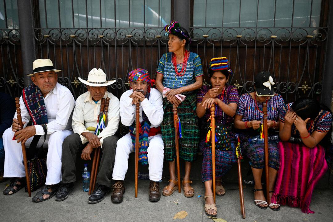 Indigenous authorities take part in a demonstration against the re-election of Guatemalan magistrate Roberto Molina Barreto outside the Congress building, where the election of two magistrates for the Constitutional Court will take place, in Guatemala City on March 5, 2026. (Photo by JOHAN ORDONEZ / AFP via Getty Images)