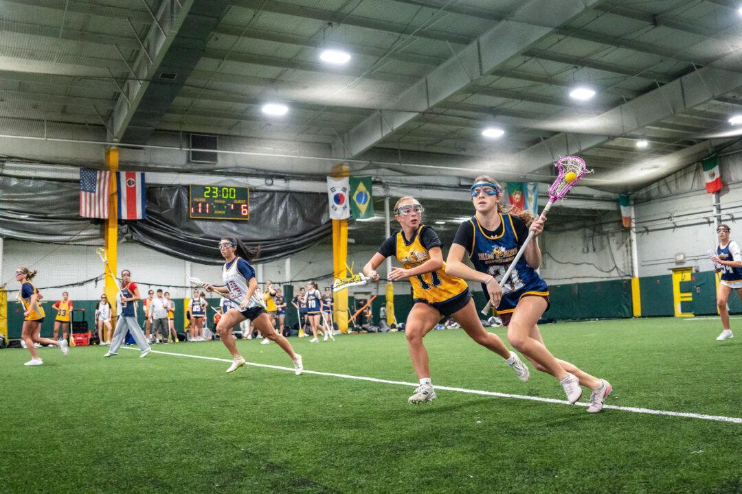 Lacrosse girls teams 2027 YJ Gaghan-Torre and 2028 YJ Bertolone practice at KK Athletics Indoor Sports in Farmingville, N.Y., on March 1, 2026. (Samira Bouaou/The Epoch Times)