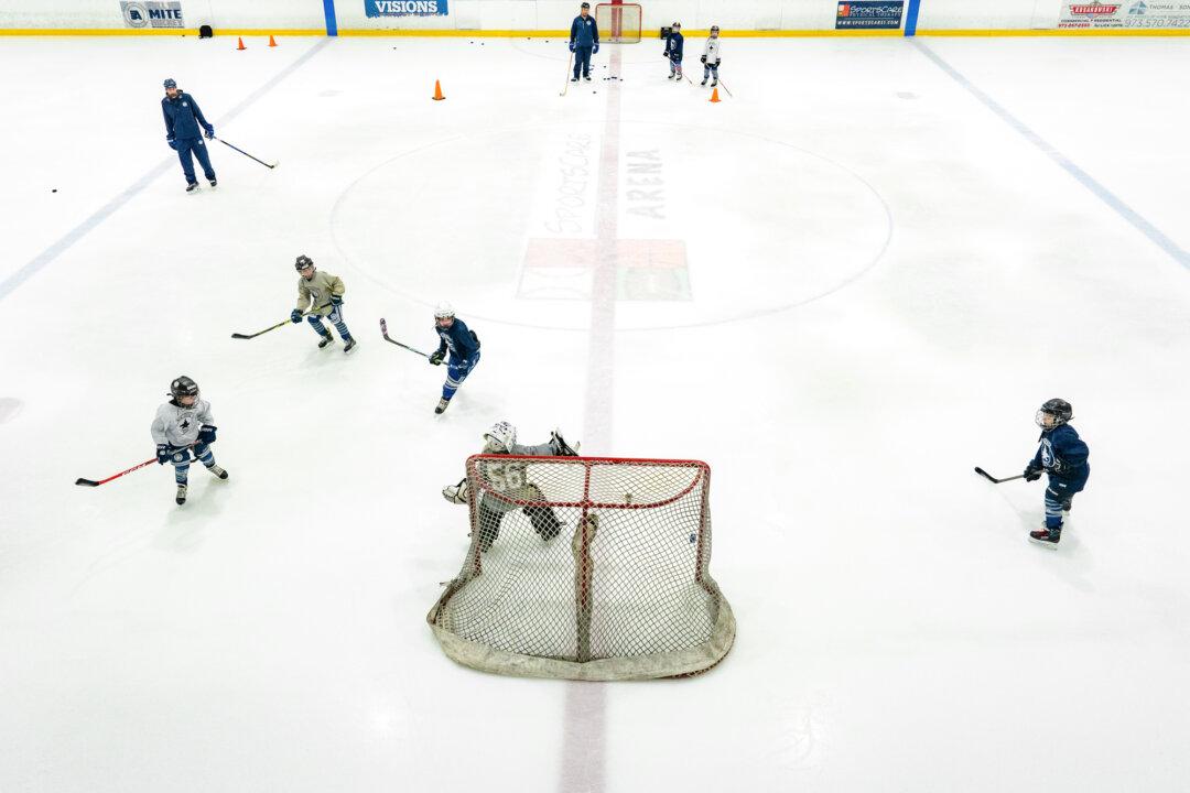 The New Jersey Jets 8u practice at the SportsCare Arena in Randolph, N.J., on Feb. 19, 2026. Dean Foti said he is witnessing the end of the three-sport athlete as children as young as 7 begin specializing in a single sport. (Samira Bouaou/The Epoch Times)