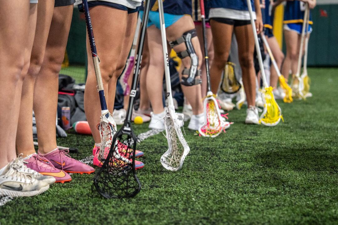 Lacrosse girls teams 2027 YJ Gaghan-Torre and 2028 YJ Bertolone practice at KK Athletics Indoor Sports in Farmingville, N.Y., on March 1, 2026. (Samira Bouaou/The Epoch Times)