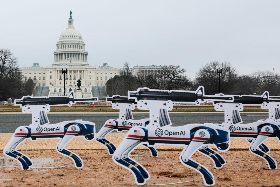 AI robot signs are planted into the ground on the National Mall in an act of protest in Washington on March 6, 2026. The robot signs are in protest against OpenAI’s decision to allow the Pentagon to use its AI technologies. (Heather Diehl/Getty Images)