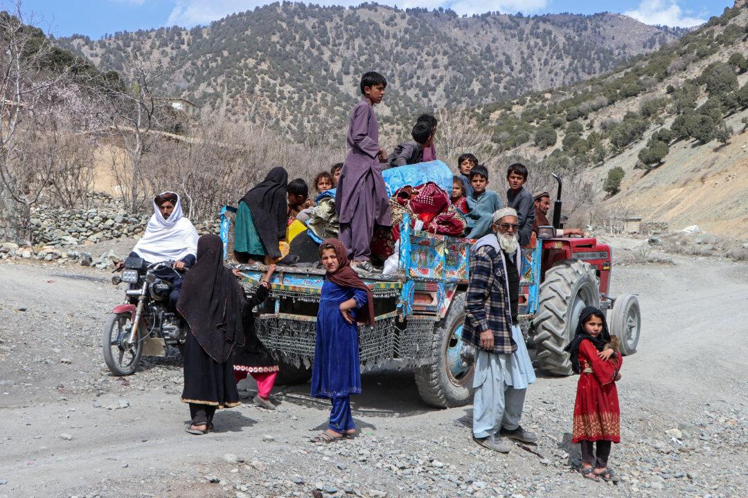 Afghan families along with children escape from the area amid the ongoing clashes between Pakistani forces and Taliban security personnel in the Samkani district, Afghanistan, on March 6, 2026. The United Nations rights chief said on March 6 that 56 Afghan civilians had been killed -- nearly half of them children -- since hostilities with neighbouring Pakistan intensified last week. (AFP via Getty Images)