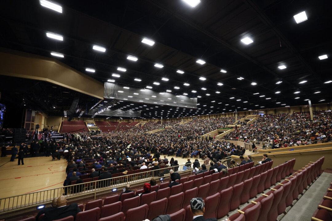 People attend a public memorial service to celebrate the life of civil rights activist Reverend Jesse Jackson in Chicago, on March 6, 2026. Veteran US civil rights activist Reverend Jesse Jackson, one of the nation's most influential Black voices, died peacefully on Feb. 17, 2026 at the age of 84. Jackson, a Baptist minister, had been a civil rights leader since the 1960s, when he marched with Martin Luther King Jr. and helped fundraise for the cause. (Kamil Krzaczynski / AFP via Getty Images)