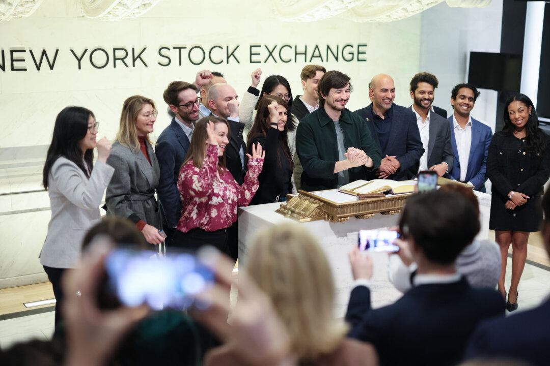 Vlad Tenev, Chairman & CEO of Robinhood Markets, (C) takes photos at the New York Stock Exchange during morning trading on March 6, 2026. Stocks continue to tumble with all three major indexes continuing to dip with the Dow Jones losing nearly 800 points at opening as oil prices raise due to concerns of the war with Iran and a weak jobs report release. (Michael M. Santiago/Getty Images)