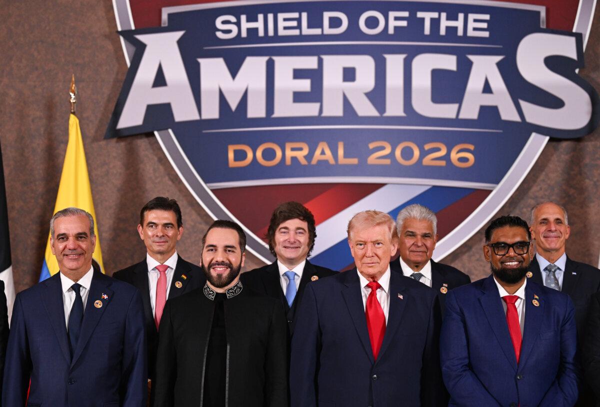 Bolivian President Rodrigo Paz Pereira (2nd L) stands with U.S. President Donald Trump (4th R) and several other Latin American leaders at the start of the "The Shield of the Americas Summit" at the Trump National Doral Golf Club in Doral, Florida, on March 7, 2026. (Roberto Schmidt/Getty Images)