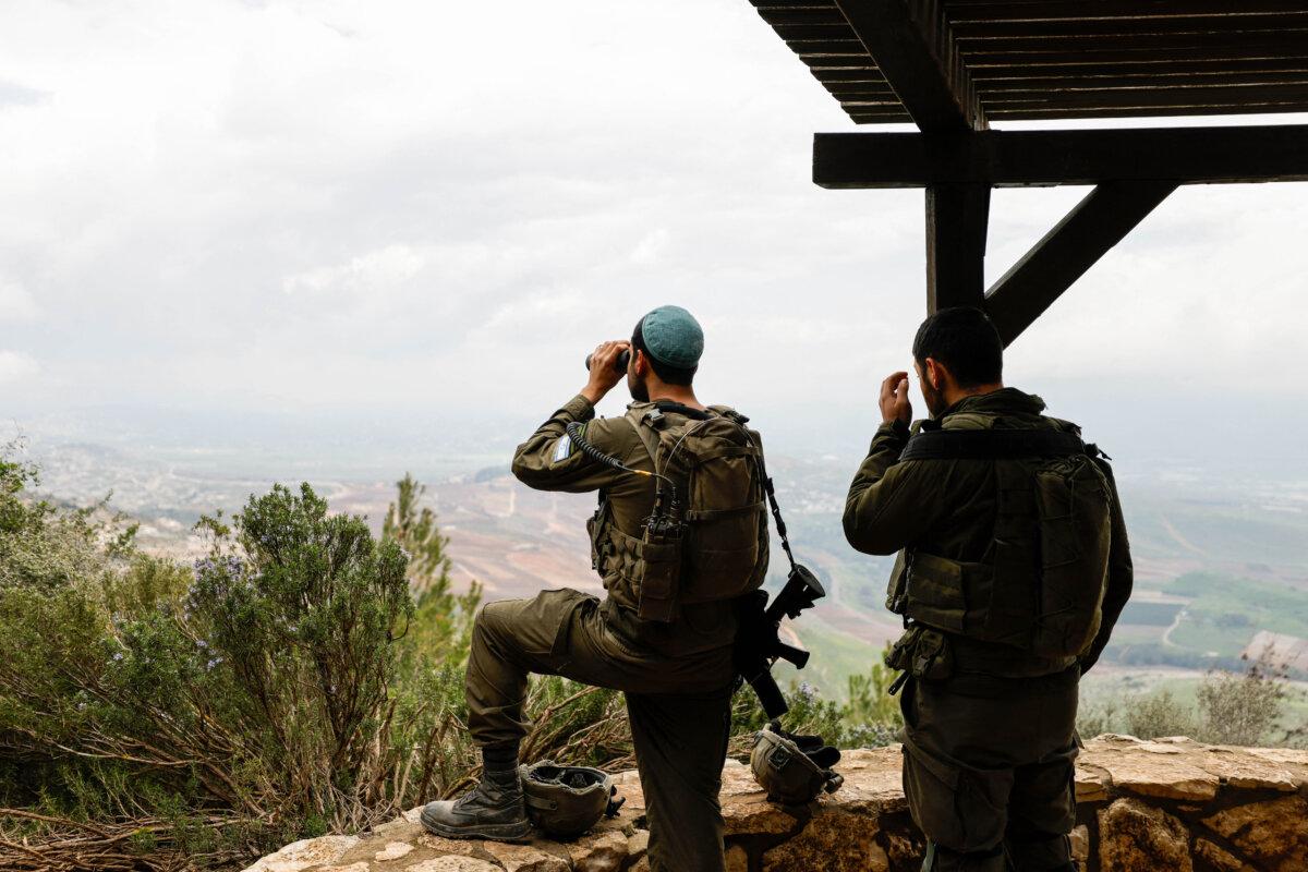 Israeli soldiers take a position along the Israel-Lebanon border on March 7, 2026. (Jalaa Marey/AFP via Getty Images)