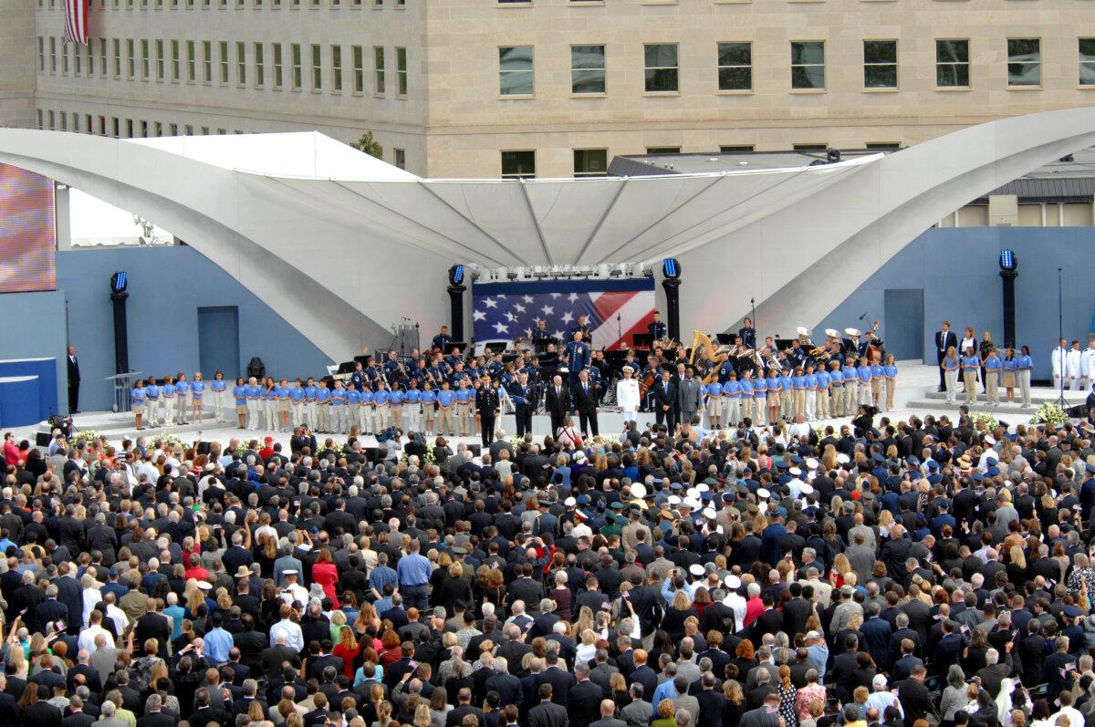 The official party and audience sing “God Bless America” at the Pentagon memorial dedication, Sept. 11, 2008. (Public Domain)