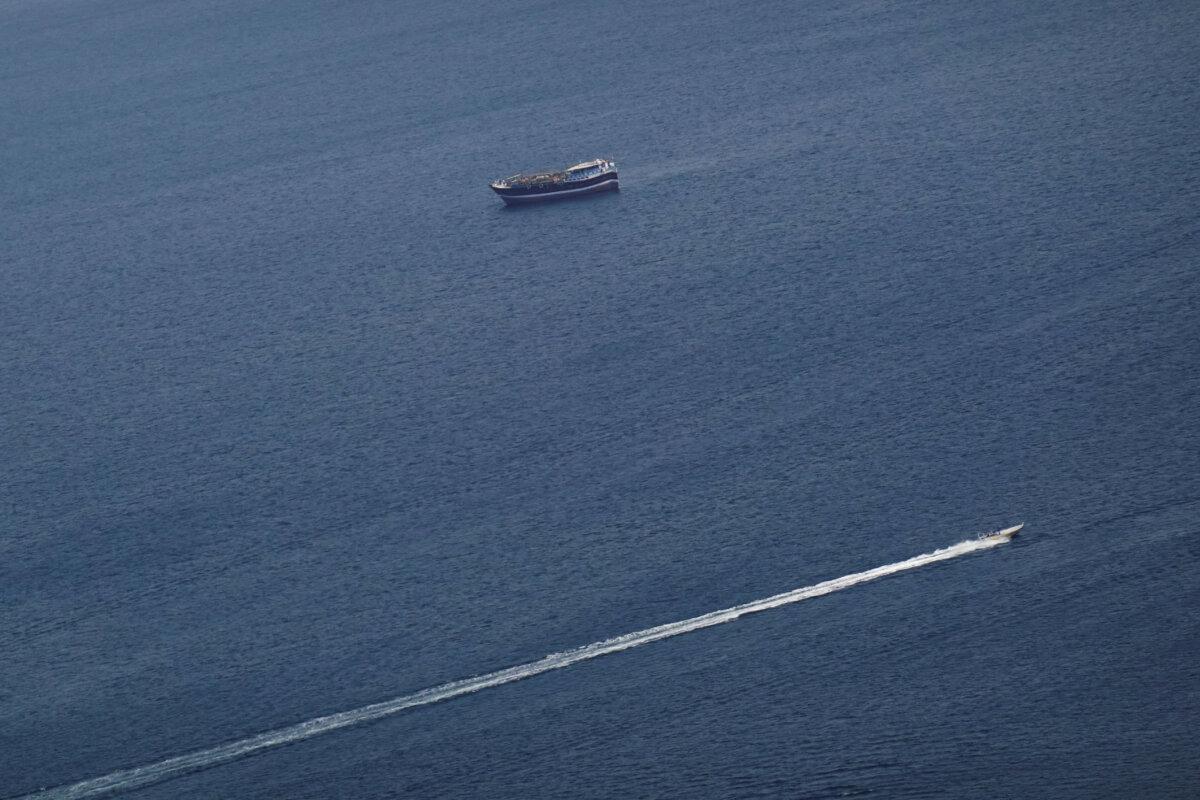 Boats in the Strait of Hormuz amid the U.S.–Israeli war with Iran, as seen from Musandam, Oman, on March 2, 2026. (Amr Alfiky/Reuters)
