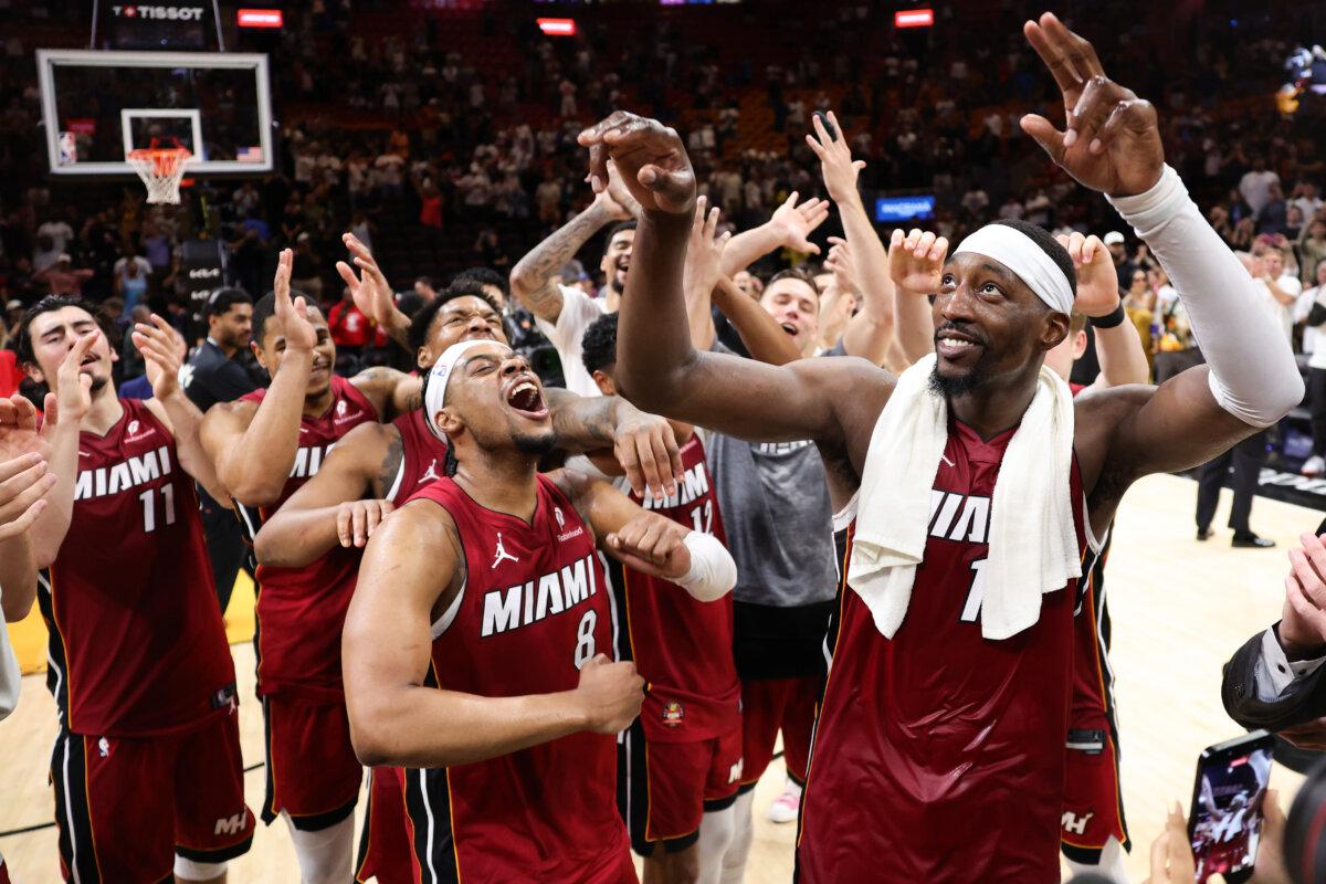 Bam Adebayo #13 of the Miami Heat celebrates with teammates after defeating the Washington Wizards at Kaseya Center in Miami on March 10, 2026. (Megan Briggs/Getty Images)