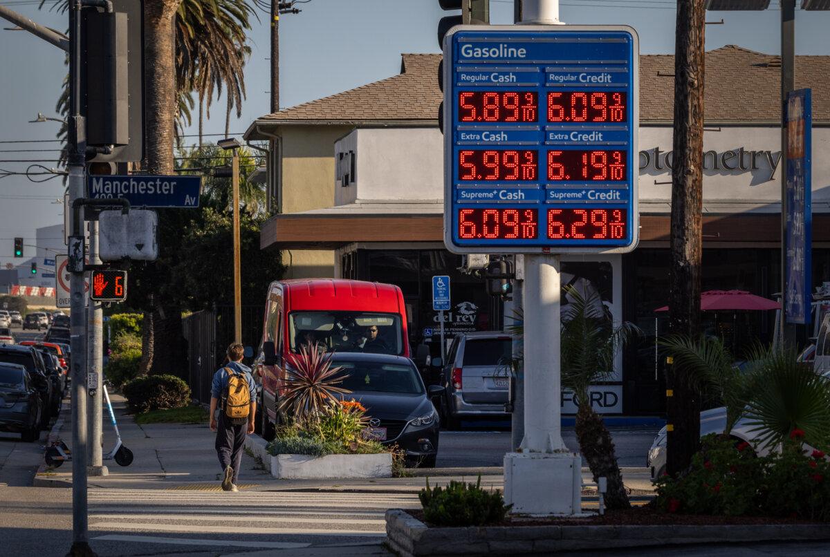 A man walks past a gas station in Los Angeles on March 11, 2026. (John Fredricks/The Epoch Times)