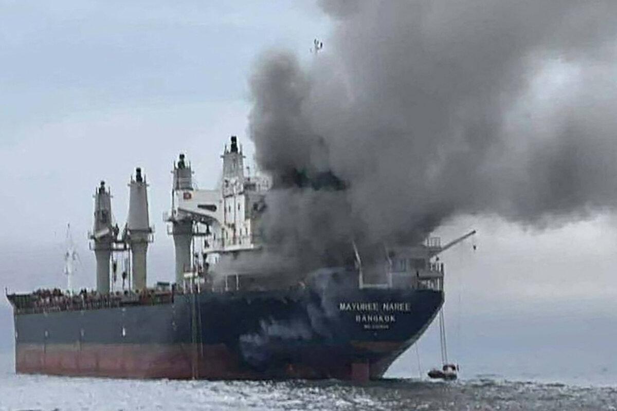Smoke rises from the Thai bulk carrier Mayuree Naree near the Strait of Hormuz after an attack by Iran's IRGC on March 11, 2026. (Handout/Royal Thai Navy/AFP via Getty Images)