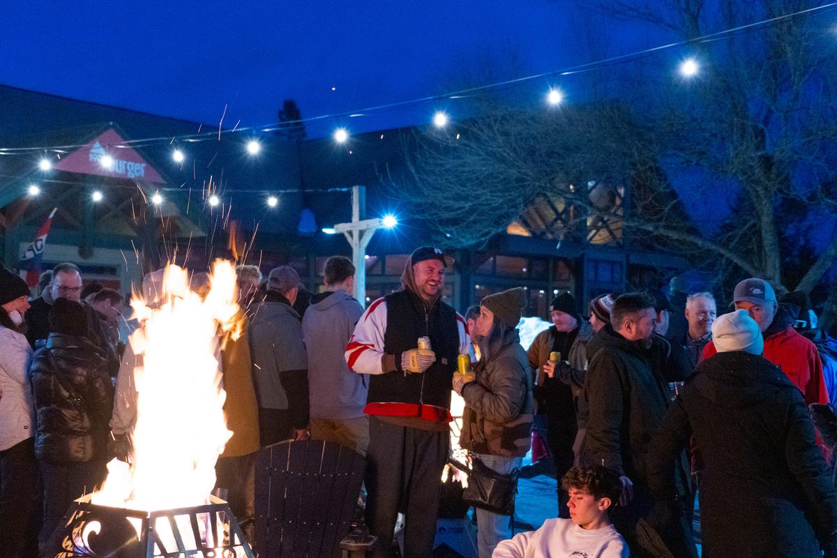 Visitors enjoy an outdoor fire at Mount Snow, Vt. (Brooke Cerbone/Vail Resorts)