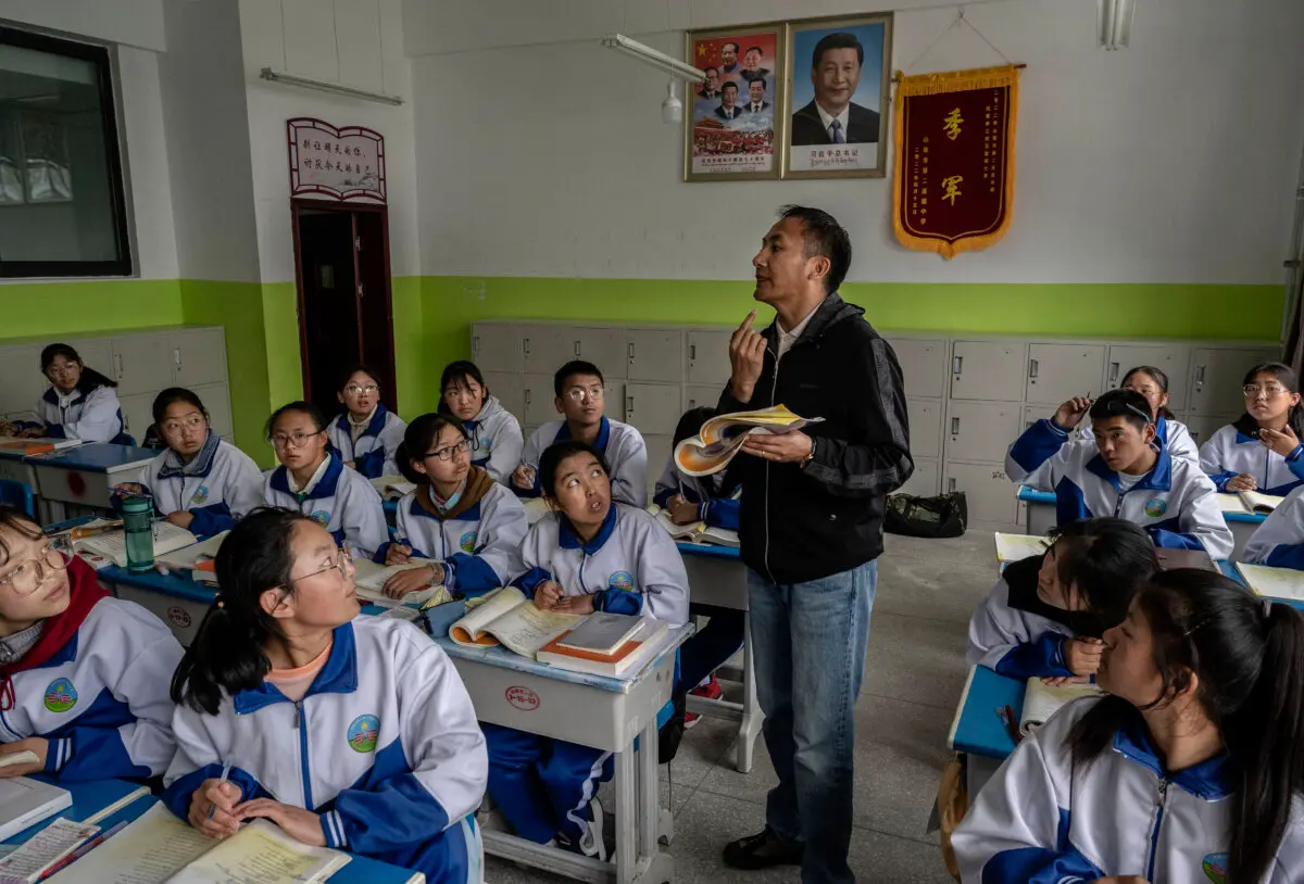 A Tibetan teacher teaches at the Second Senior High School, during a state-organized visit in Shannan, Tibet, China, on June 18, 2023. (Kevin Frayer/Getty Images)