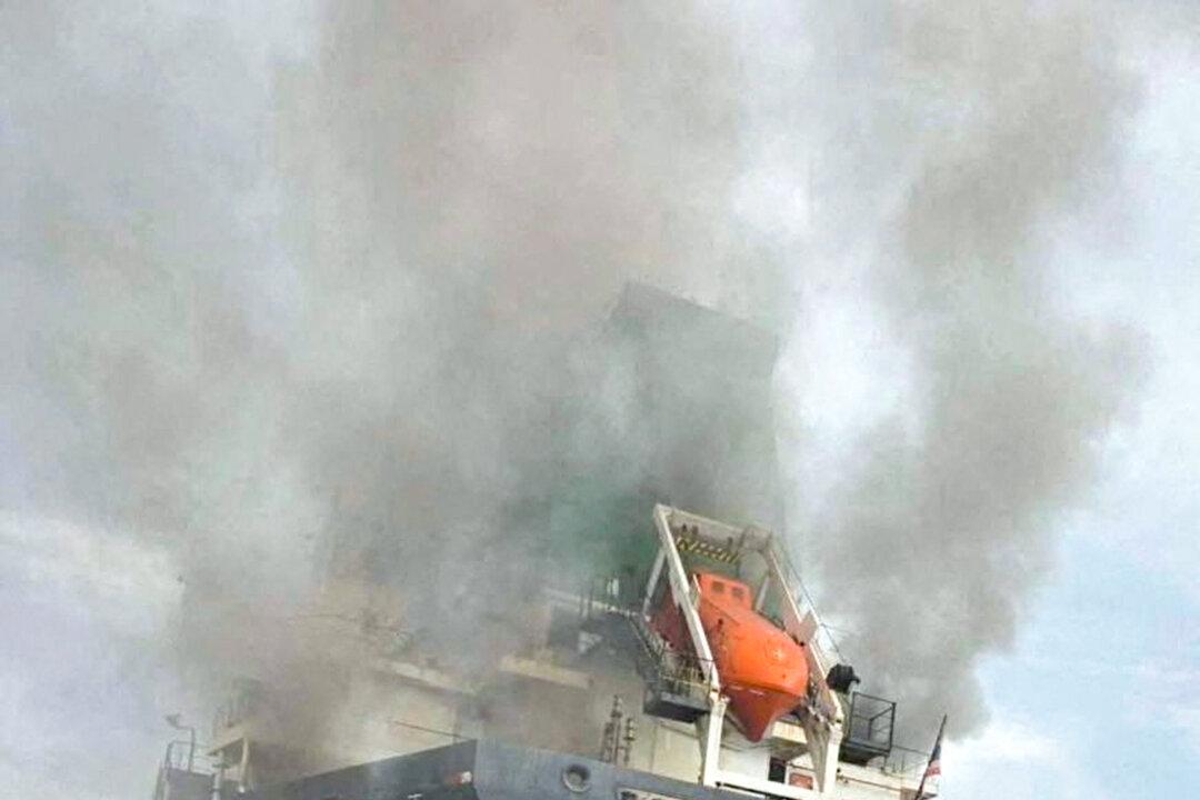 Smoke rising from the Thai bulk carrier “Mayuree Naree”after an attack in the Strait of Hormuz on March 11, 2026. (Royal Thai Navy/Handout Via Reuters)