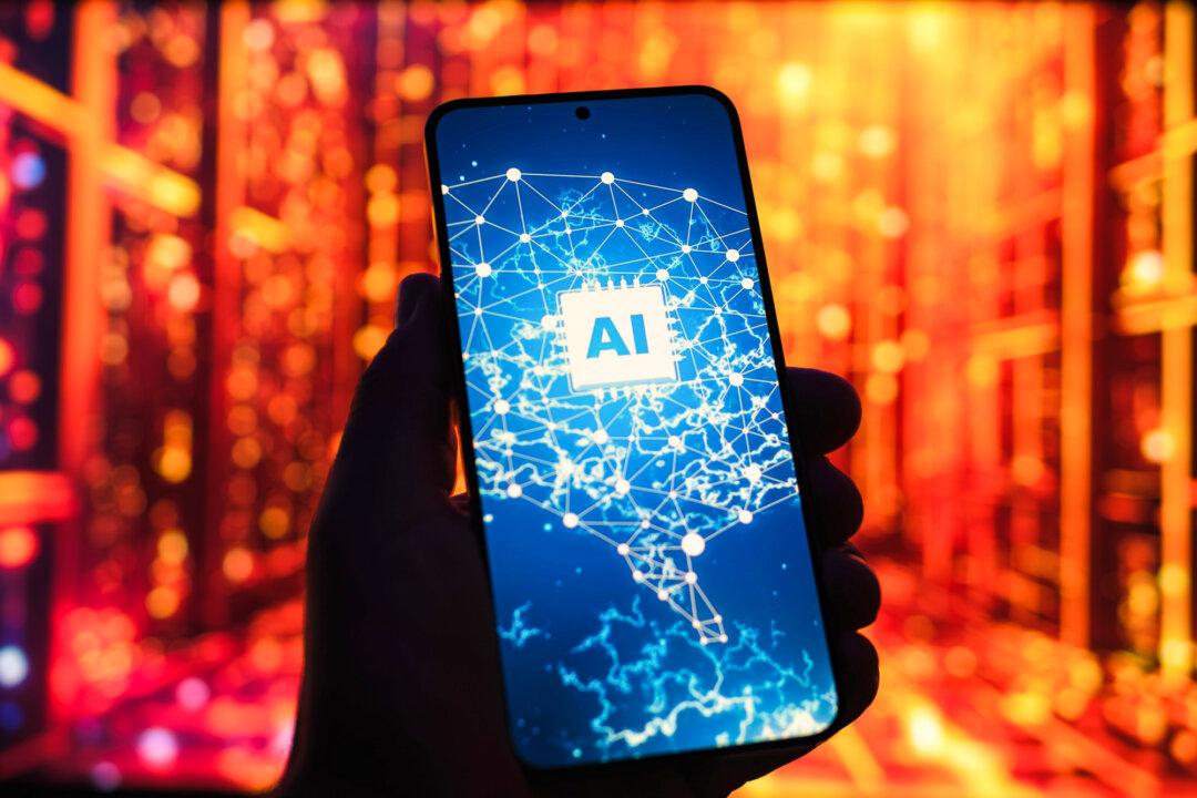 A phone screen displaying an artificial intelligence logo is shown in this photo illustration on May 16, 2025. As the landscape of autonomous AI systems evolves, there is growing concern that the technology is becoming increasingly strategic or deceptive under certain conditions. (Oleksii Pydsosonnii/The Epoch Times)