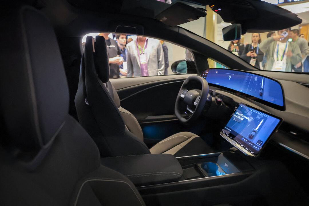 A robotaxi developed by Lucid, Nuro, and Uber is unveiled during Nvidia Live at CES 2026 in Las Vegas on Jan. 5, 2026. Self-driving cars use multistep agentic systems to break complex problems into smaller, actionable steps. (Patrick T. Fallon/AFP via Getty Images)