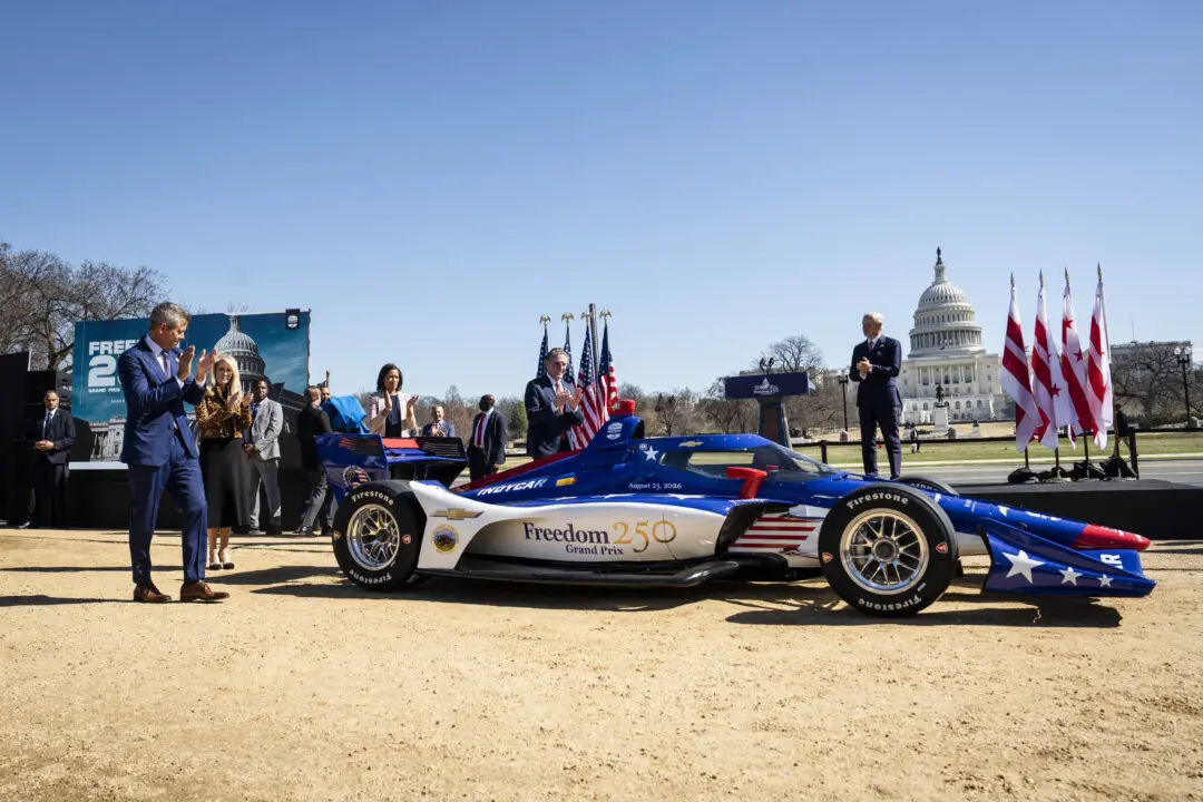 White House Chief of protocol Monica Crowley, Washington Mayor Muriel Bowser, Transportation Secretary Sean Duffy, and Interior Secretary Doug Burgum unveil the new Indycar for the Freedom 250 Grand Prix, in Washington on March 9, 2026. The Aug. 23 street circuit will feature a 1.7 mile course with seven turns on the National Mall, celebrating Americaís 250th birthday.(Madalina Kilroy/The Epoch Times)