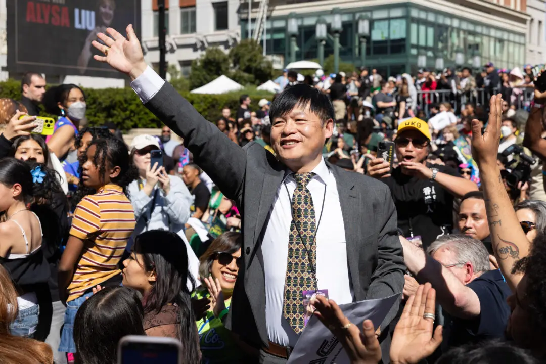 Olympic gold medalist Alysa Liu's dad, Arthur Liu, is acknowledged during a rally celebrating her accomplishments at the Milano Cortina 2026 Olympics in Oakland, Calif,. on March 12, 2026. Liu won the United States first gold medal in women's singles figure skating since 2002. (Benjamin Fanjoy/Getty Images)