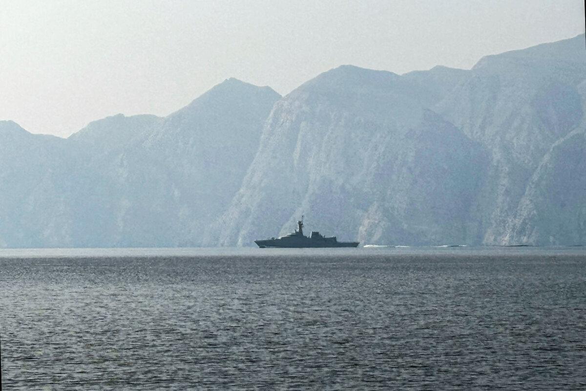 A navy vessel sails in the Strait of Hormuz, a vital waterway through which much of the world's oil and gas passes, on March 1, 2026. (Sahar Al Attar/AFP via Getty Images)
