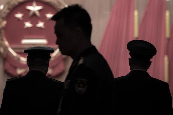 Members of the Chinese military delegation arrive at the closing session of the rubber-stamp National People's Congress at the Great Hall of the People in Beijing on March 12, 2026. (Kevin Frayer/Getty Images)