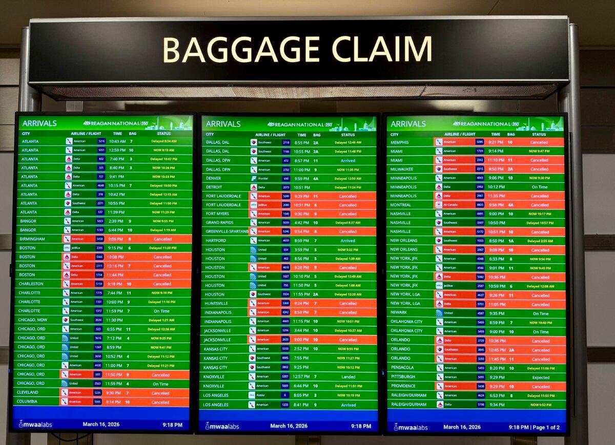 The arrivals board displaying multiple canceled and delayed flights is shown at Ronald Reagan Washington National Airport in Arlington, Va., on March 16, 2026. (Daniel Slim/AFP via Getty Images)