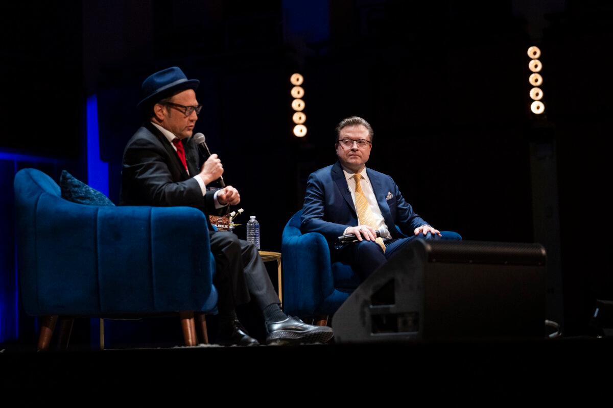 Comedian and actor Rob Schneider and Jan Jekielek, Epoch Times senior editor and host of American Thought Leaders, talk during Jekielek’s “Killed to Order” book launch at the Trump-Kennedy Center in Washington on March 16, 2026. (Madalina Kilroy/The Epoch Times)