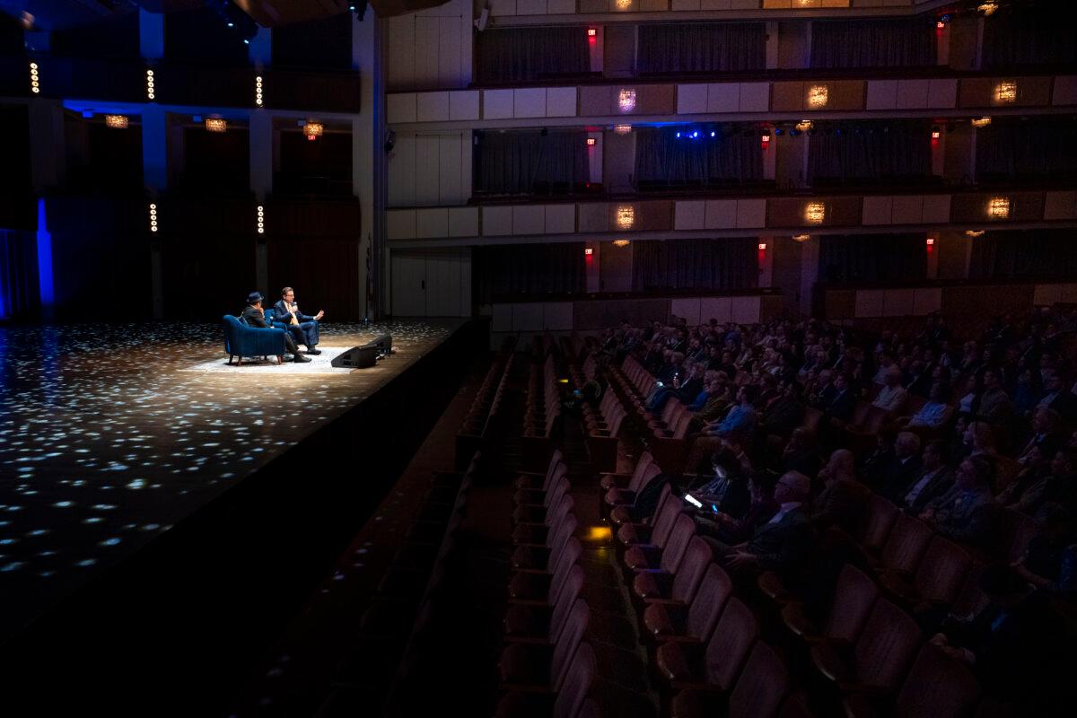 Comedian and actor Rob Schneider and Jan Jekielek, Epoch Times senior editor and host of American Thought Leaders, talk during Jekielek’s “Killed to Order” book launch at the Trump-Kennedy Center in Washington on March 16, 2026. (Madalina Kilroy/The Epoch Times)