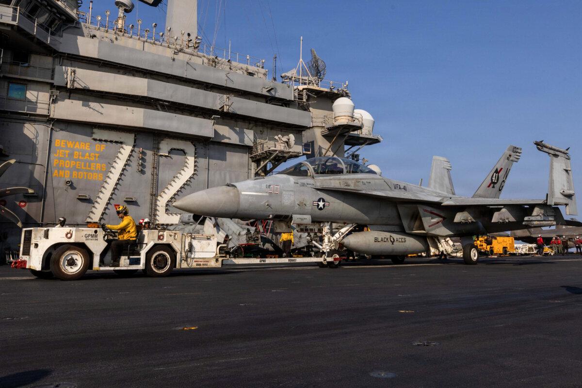An F/A-18F Super Hornet, attached to Strike Fighter Squadron (VFA) 41, is taxied on the flight deck of Nimitz-class aircraft carrier USS Abraham Lincoln (CVN 72) in support of Operation Epic Fury in the Mediterranean Sea, on March 6, 2026. (U.S. Navy via Getty Images)
