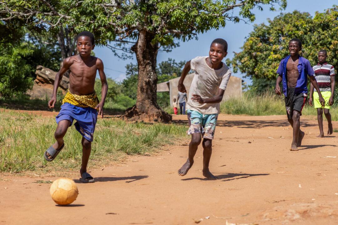 Villagers play soccer in the Mwanza district, Malawi, on Feb. 24, 2026. (John Fredricks/The Epoch Times)