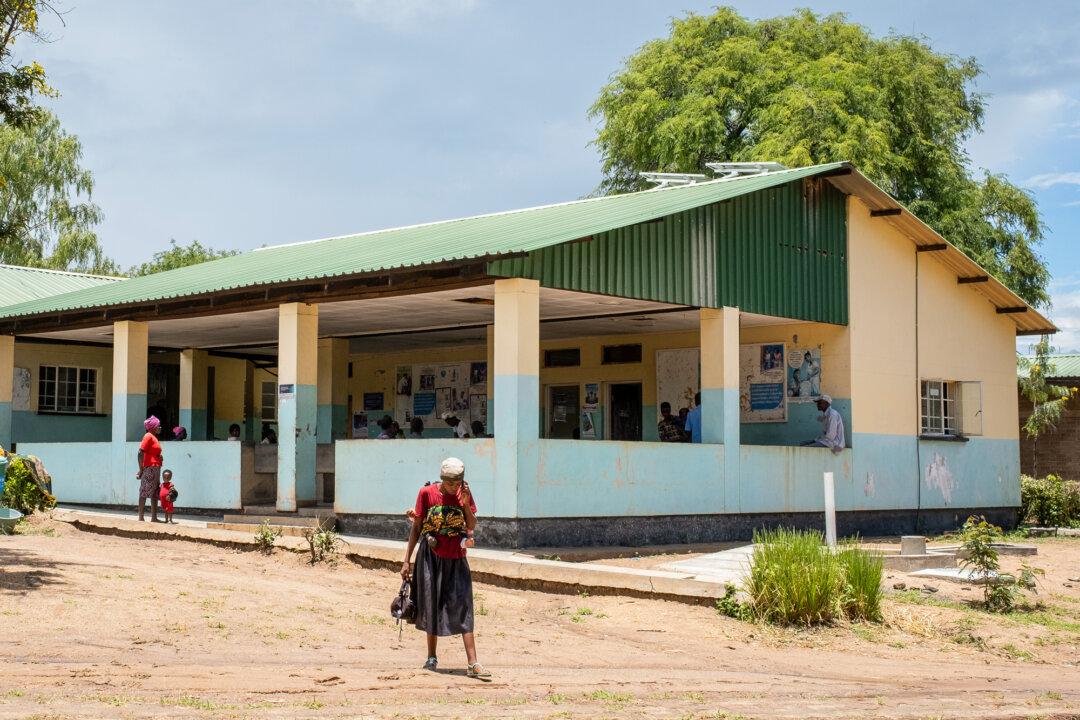 People leave a rural hospital outside of Monkey Bay, Malawi, on Feb. 18, 2026. (John Fredricks/The Epoch Times)