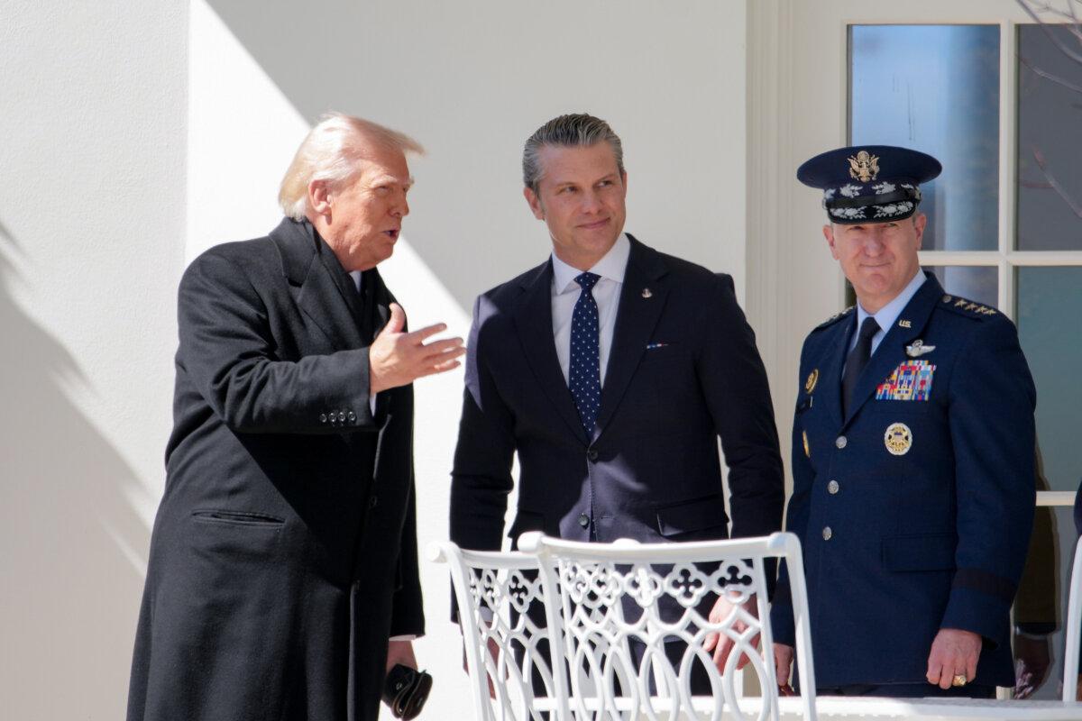 U.S. President Donald Trump, accompanied by U.S. War Secretary Pete Hegseth and Chairman of the Joint Chiefs of Staff Gen. Dan Caine, at the White House on March 18, 2026. (Andrew Harnik/Getty Images)