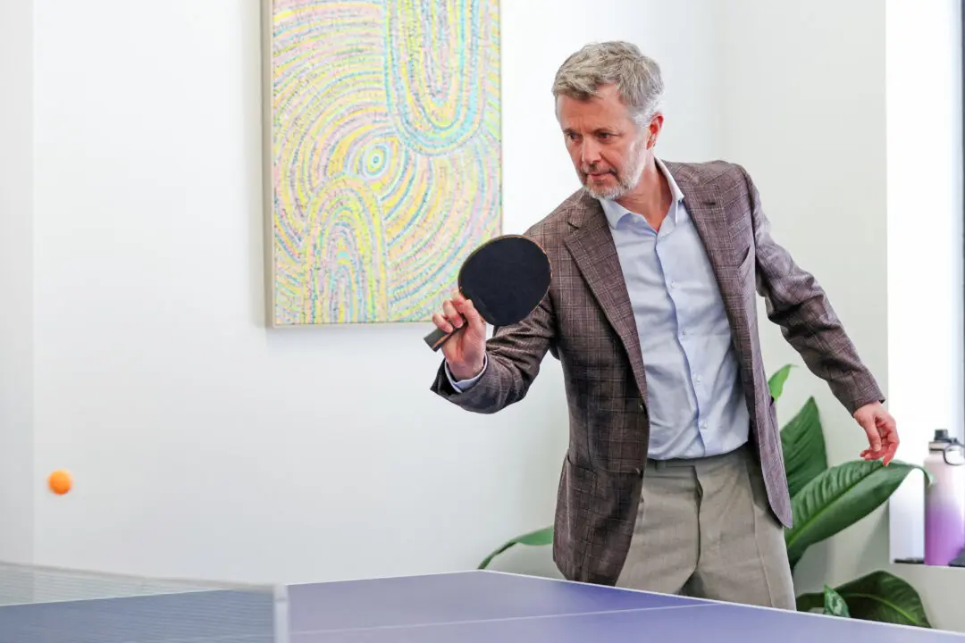 Denmark's King Federik X plays table-tennis during a visit to the Headspace National Youth Reference Group and Headspace South Melbourne Youth Advisory Group in Melbourne, Australia, on March 18, 2026. (Jesse Thompson / POOL / AFP via Getty Images)
