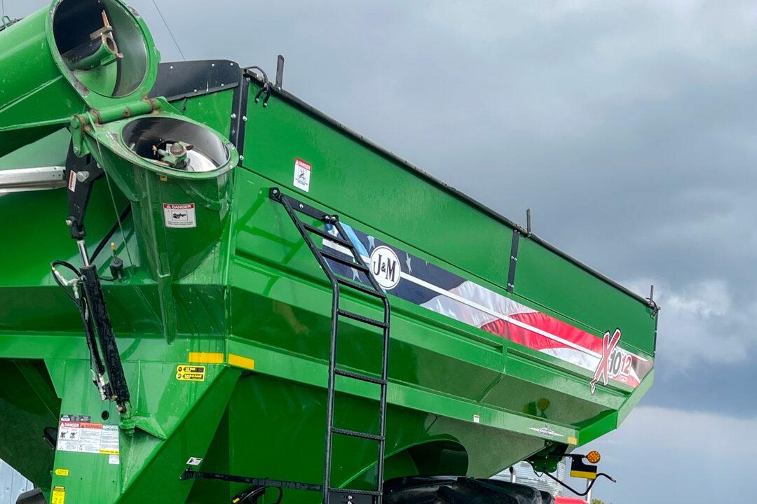 (Top) (L–R) Brittney and Tyler Everett; Secretary of Agriculture Brooke Rollins; Carolyn, Nanette, and Doug Everett pose in front of a combine at Everett Farms in Lebanon, Ind., in October 2025. (Bottom Left) Doug Everett manages a sprayer at Everett Farms in Lebanon, Ind., on May 11, 2025. (Bottom Right) Farmer Tyler Everett and his daughter clean a grain cart at Everett Farms in Lebanon, Ind., on Sept. 1, 2023. (Courtesy of Tyler Everett)