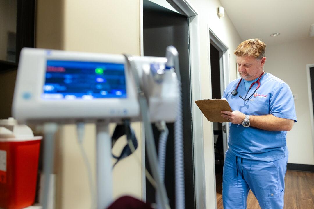 Dr. Brian Tyson reviews notes at his clinic near El Centro, Calif., on Jan. 19, 2026. Tyson said that since the border crisis eased, emergency services are no longer overwhelmed with 911 calls, and his patient volumes have returned to normal. (John Fredricks/The Epoch Times)