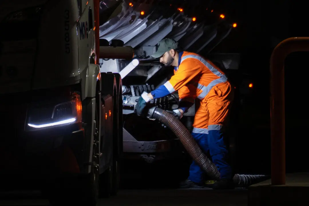 A fuel tanker driver fills the tanks of a petrol station in Wellington on March 19, 2026. Oil prices extended gains on March 19 after strikes against energy infrastructure in the Middle East raised further concerns over supply. (Photo by Marty MELVILLE / AFP via Getty Images)