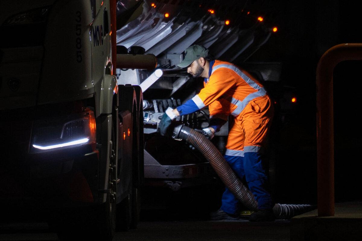 A fuel tanker driver fills the tanks of a petrol station in Wellington, New Zealand, on March 19, 2026. Oil prices extended gains on March 19 after strikes against energy infrastructure in the Middle East raised further concerns over supply. (Marty Melville/AFP via Getty Images)
