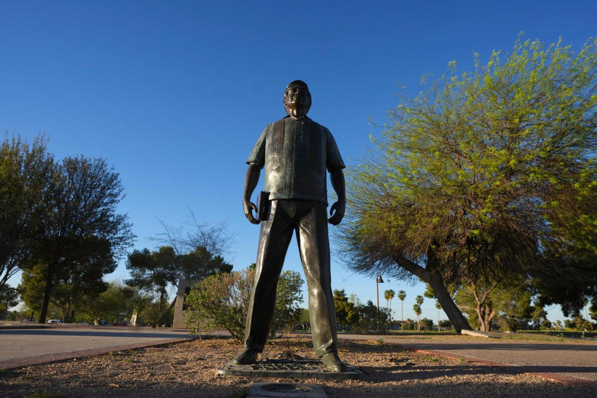 A statue of Cesar Chavez stands in the middle of a plaza at Cesar Chavez Park, honoring the United Farm Workers of America founder in Laveen, Ariz., on March 18, 2026. (AP Photo/Ross D. Franklin)
