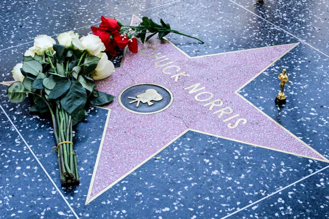 Flowers are left on the Hollywood Walk of Fame star of Chuck Norris, awarded in December 1989, following news of his death on March 20, 2026, in Hollywood, California. Chuck Norris, the US martial artist and Hollywood tough guy most famous for his role in the "Walker, Texas Ranger" television series, has died, his family said March 20. He was 86. Norris passed away Thursday morning, March 19, the family said on Instagram, after media reports that he had been hospitalized for an undisclosed condition while on the Hawaiian island of Kauai. (Photo by Frederic J. Brown / AFP via Getty Images)