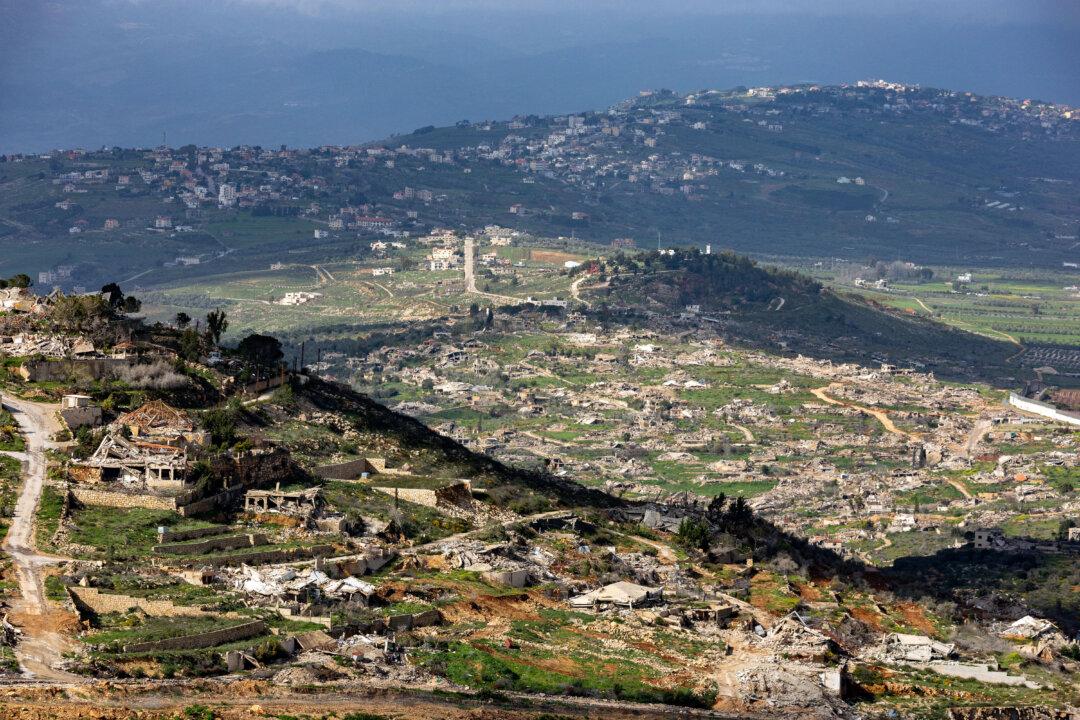 TOPSHOT - Destroyed houses and buildings in southern Lebanon are seen across the border from the Upper Galilee in northern Israel on March 20, 2026. The United States and Israel began the war on February 28, 2026, by attacking Iran and killing its supreme leader. Iran retaliated with strikes against Israel and US allies and interests across the Gulf and Iraq, drawing the whole region into war. Lebanon was drawn into the conflict on March 2 when Hezbollah militants launched rockets at Israel after the killing of the Iranian supreme leader. (Photo by Odd ANDERSEN / AFP via Getty Images) /