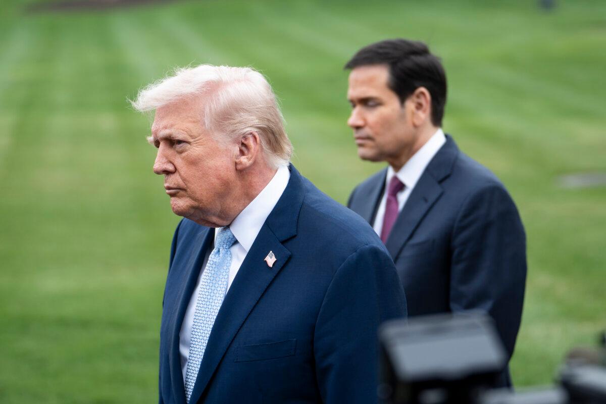 Secretary of State Marco Rubio accompanies President Donald Trump as they depart the White House on March 20, 2026. (Madalina Kilroy/The Epoch Times)