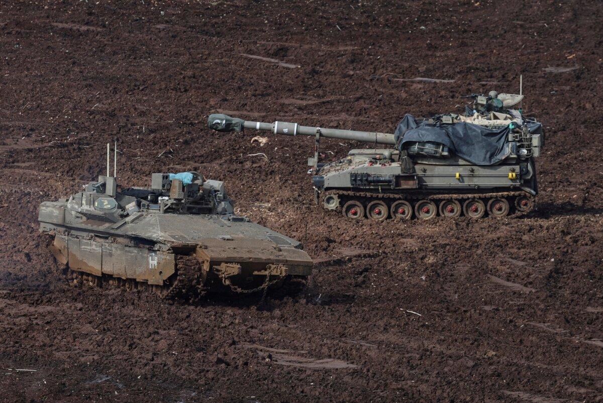 Military vehicles on the Israeli side of the border with Lebanon, amid the U.S.–Israeli conflict with Iran, in northern Israel, March 20, 2026. (Reuters/Tyrone Siu)