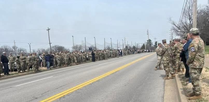 Military personnel await the procession honoring a fallen soldier who died during Operation Epic Fury, Staff Sgt. Benjamin Pennington, 26, in his home community, Hardin County, Ky., on March 20, 2026. (Courtesy of Daniel O'Dell)